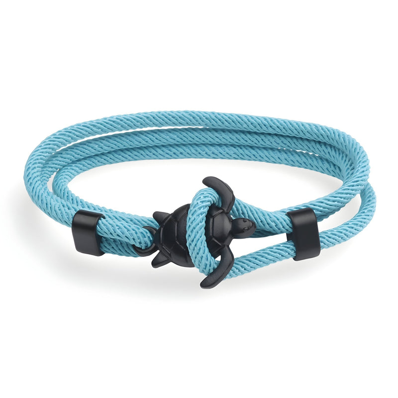 Bracelet cordon turquoise double tour avec motif tortue noir en métal.