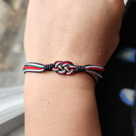 Bracelet cordon à noeud avec couleurs du drapeau de la Palestine, style ajustable pour poignet.