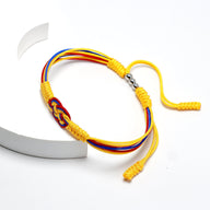 Bracelet cordon jaune avec nœud coulissant rouge, bleu et jaune aux couleurs de la Colombie.