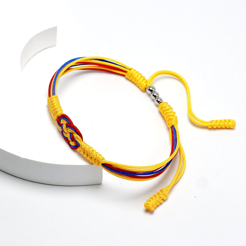 Bracelet cordon jaune avec nœud coulissant rouge, bleu et jaune aux couleurs de la Colombie.