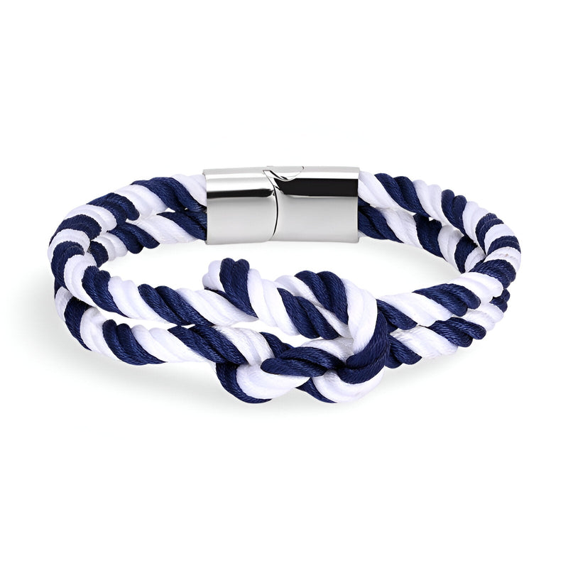Bracelet cordon épais bleu et blanc noué avec fermoir métallique argenté.