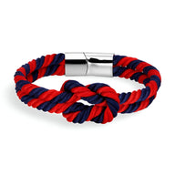 Bracelet cordon épais bleu et rouge avec nœud et fermoir métallique argenté brillant.