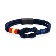 Bracelet cordon bleu marine avec nœud et drapeau espagnol en rouge, jaune et rouge, fermoir noir mat.