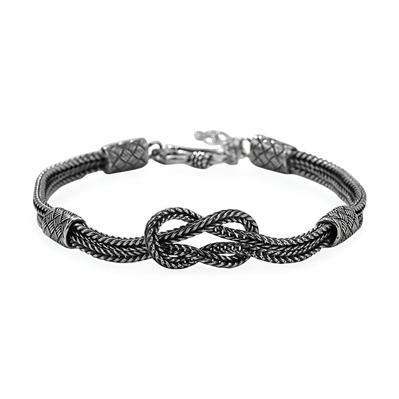 Bracelet cordon gris en argent sterling tressé avec noeud central et fermoir lobster.