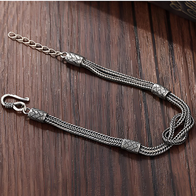 Bracelet cordon gris en argent sterling 925 avec tresses et nœuds décoratifs, fermoir mousqueton.