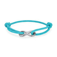 Bracelet cordon cyan avec ornement infini en métal argenté ajustable.