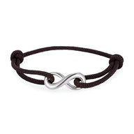 Bracelet cordon noir avec ornement infini en métal argenté et nœuds coulissants ajustables.