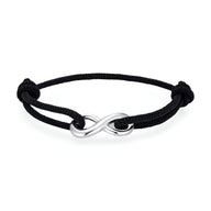 Bracelet cordon noir avec ornement infini en métal argenté, design ajustable élégant.