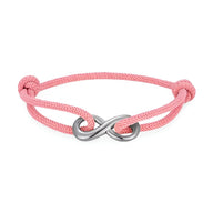 Bracelet cordon rose avec ornement infini en métal argenté, ajustable avec nœuds coulissants.