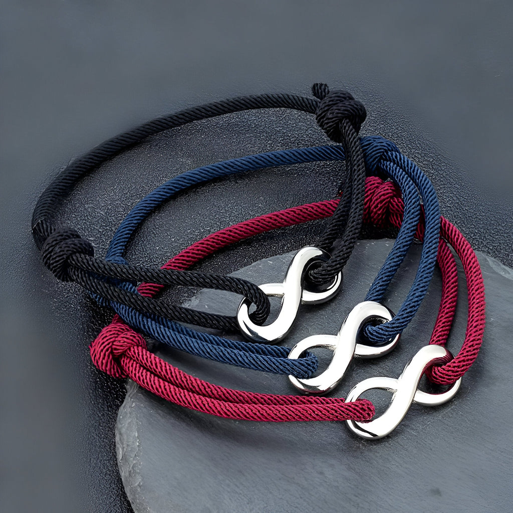 Lot de bracelets cordon ajustables avec ornement infini argenté en noir, bleu marine et bordeaux.