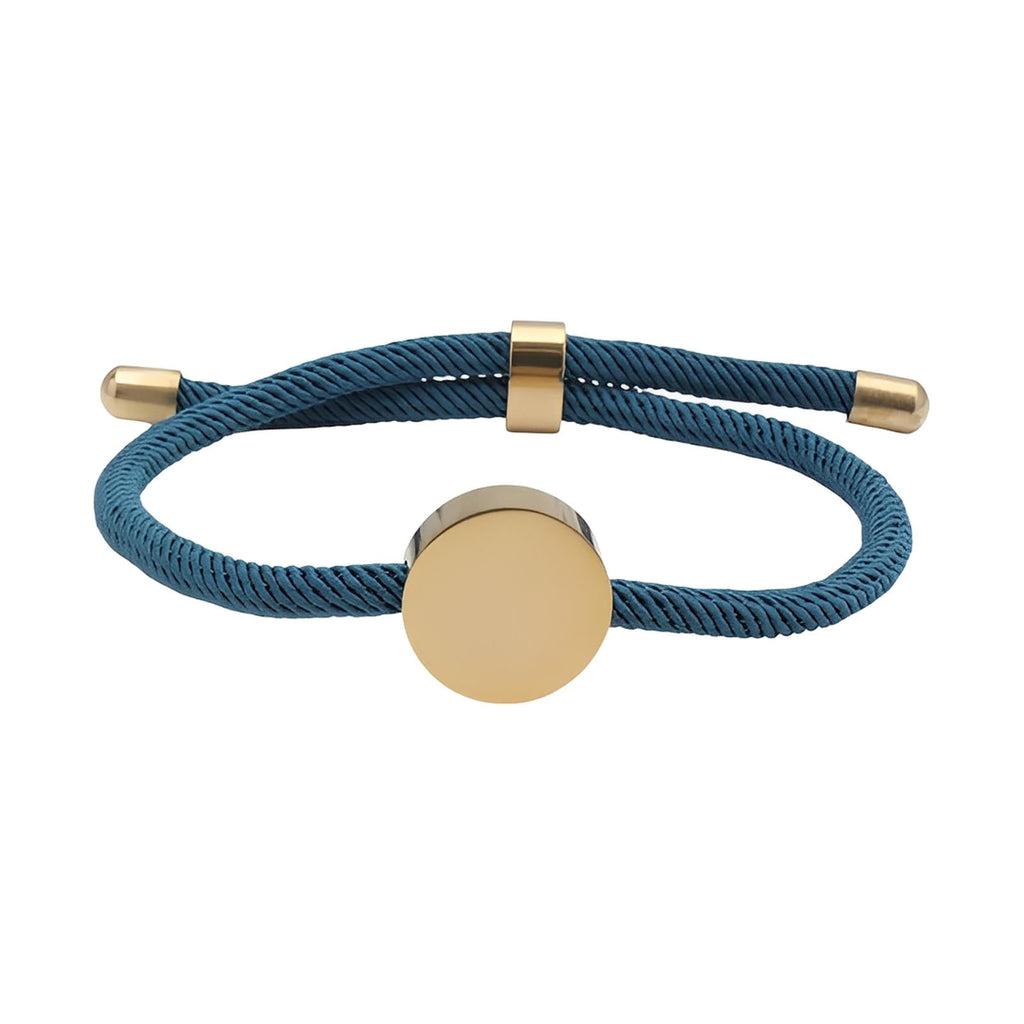 Bracelet cordon bleu marine avec médaillon rond en acier inox doré, style épuré et ajustable.