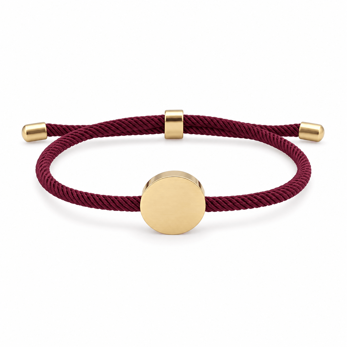 Bracelet Dax Or / Bordeaux, cordon ajustable et médaillon rond, posé de face sur fond blanc