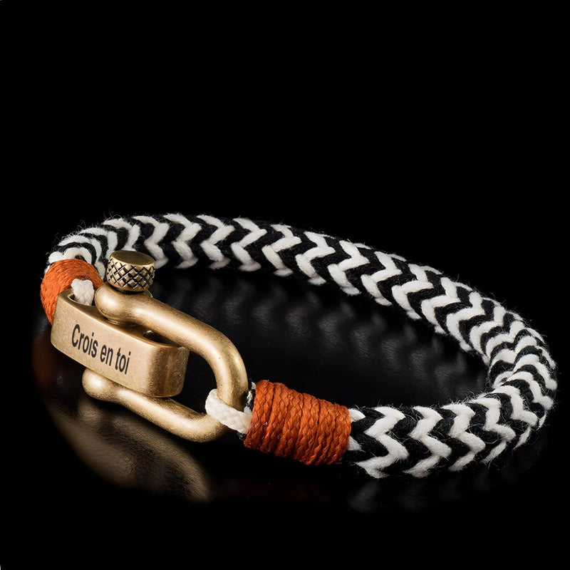 Bracelet cordon noir et blanc à motif chevrons, fermoir mousqueton métal doré gravé "Crois en toi".