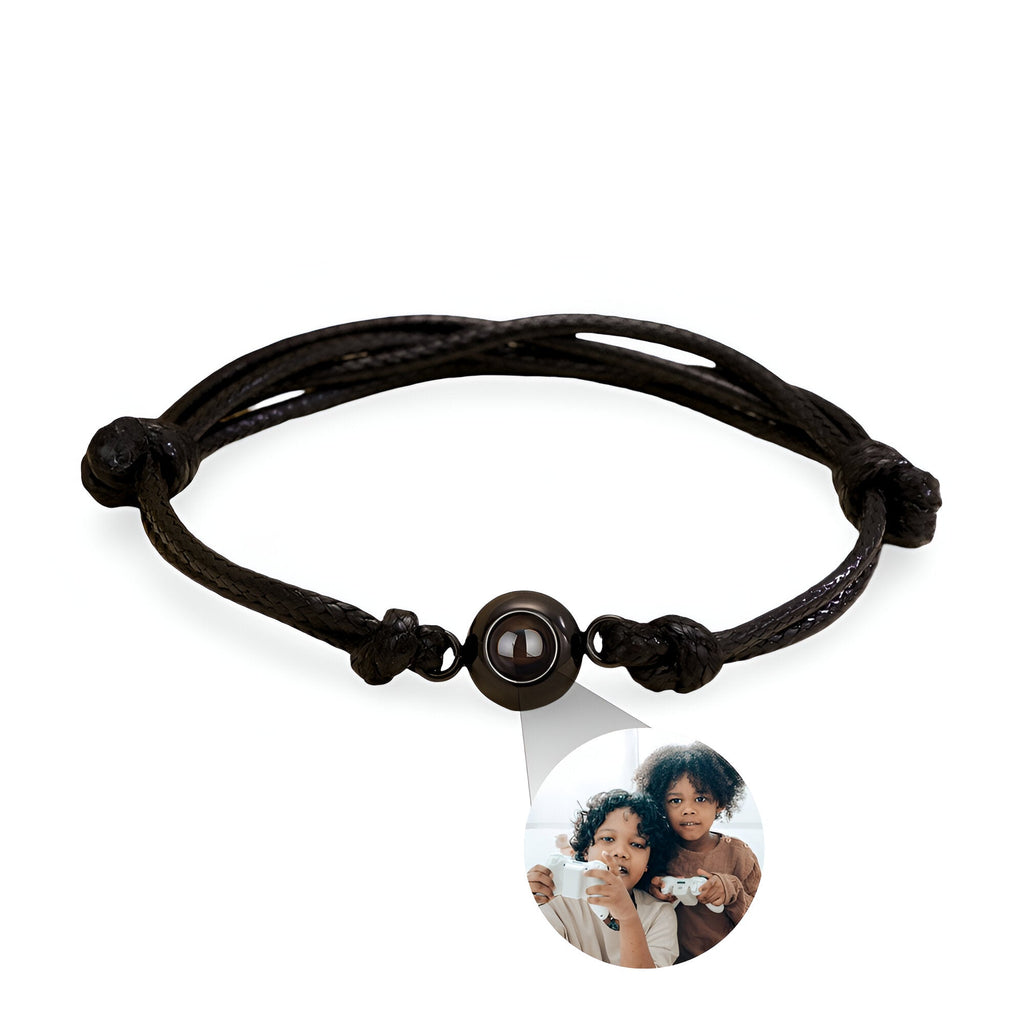 Bracelet corde noir avec médaille personnalisée en acier inoxydable et photo ronde transparente.