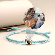 Bracelet personnalisé bleu clair en corde tressée avec breloque patte de chien en argent 925.
