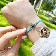 Bracelet bleu en corde avec pendentif patte de chien en argent 925 et médaillon photo personnalisé.