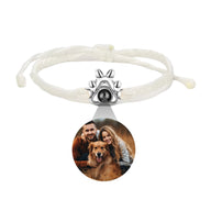 Bracelet corde blanc avec patte de chien en argent 925 et médaillon photo rond personnalisable.