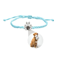 Bracelet corde bleu clair avec breloque patte de chien en argent 925 et photo personnalisée.