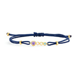 Bracelet cordon bleu marine avec argent sterling doré et trois zircons colorés rond adaptés aux femmes.