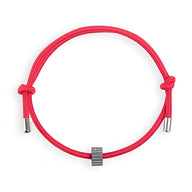 Bracelet cordon rouge avec ornement cylindrique en carbure de tungstène noir mat.