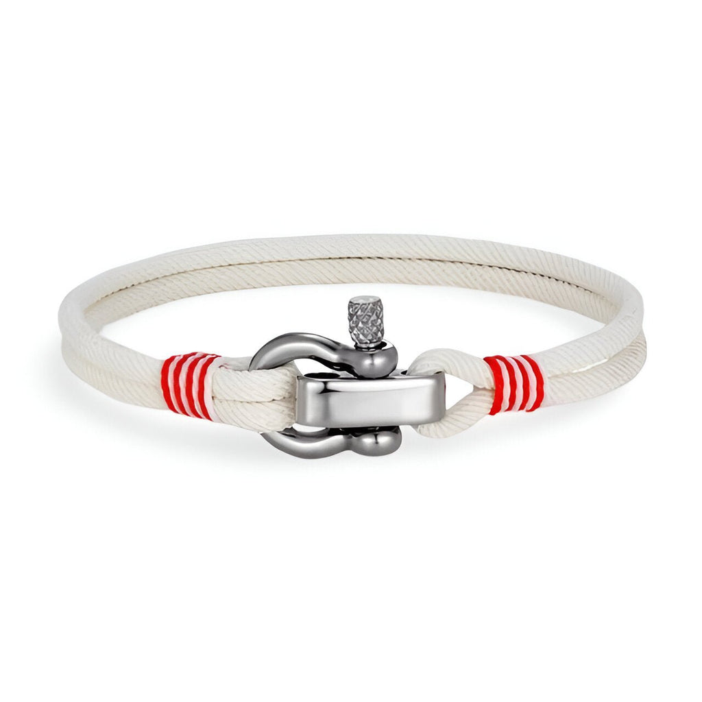 Bracelet cordon blanc avec manille en acier inoxydable et détails rouges sur les attaches.