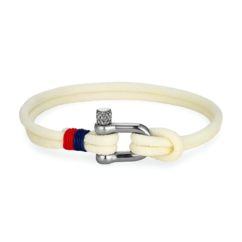 Bracelet cordon blanc avec manille en acier poli et détails noués rouge et bleu.