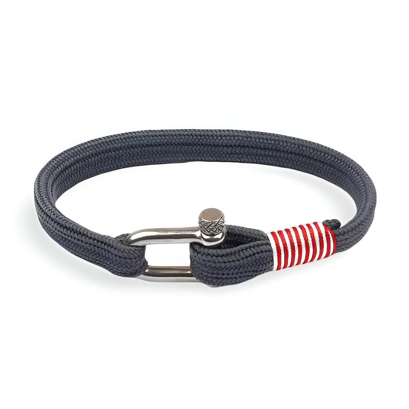 Bracelet cordon marine avec mousqueton argenté et détail rayé rouge et blanc.