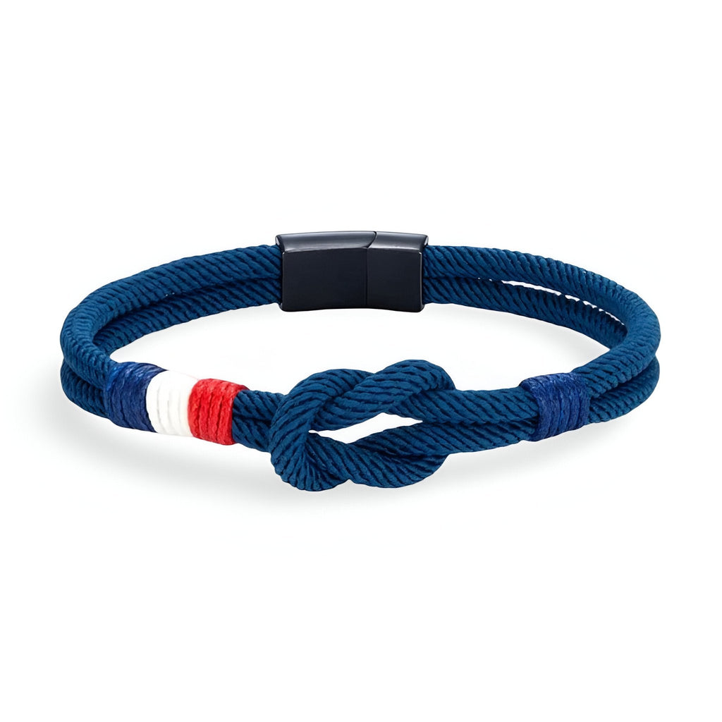 Bracelet cordon bleu marine avec noeud et détail tricolore rouge, blanc, bleu, fermoir noir mat.