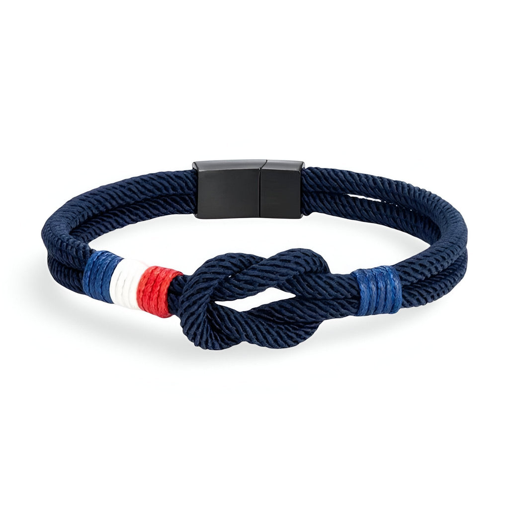Bracelet cordon bleu marine avec noeud et détail drapeau français rouge, blanc, bleu, fermoir noir mat.