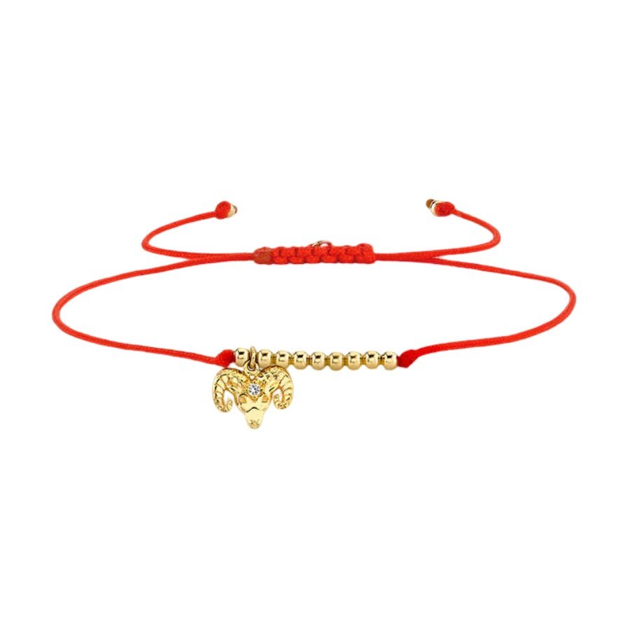 Bracelet cordon rouge avec perles dorées et pendentif signe du zodiaque Bélier.