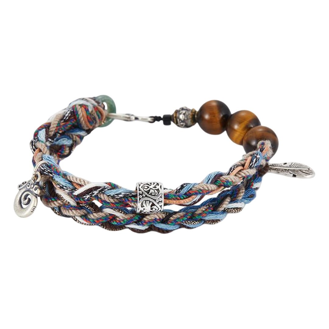 Bracelet cordon tressé multicolore avec perles en œil de tigre et jade, breloques dragon et plume en métal, fermoir crochet.