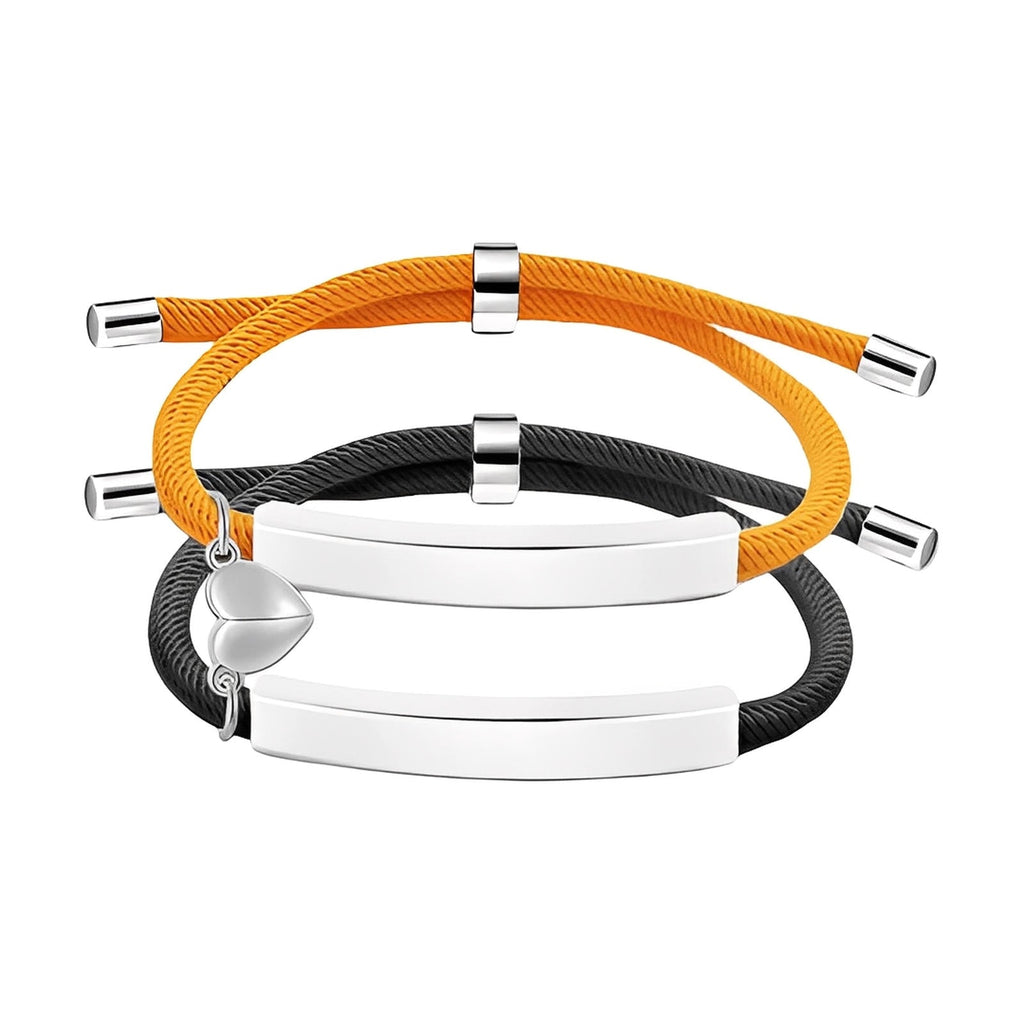 Bracelets couple en corde orange et noire, acier inoxydable avec plaques gravables et cœur aimanté argenté.