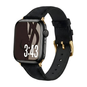 Bracelet en cuir noir doux pour Apple Watch avec boucle dorée élégante et finitions soignées.