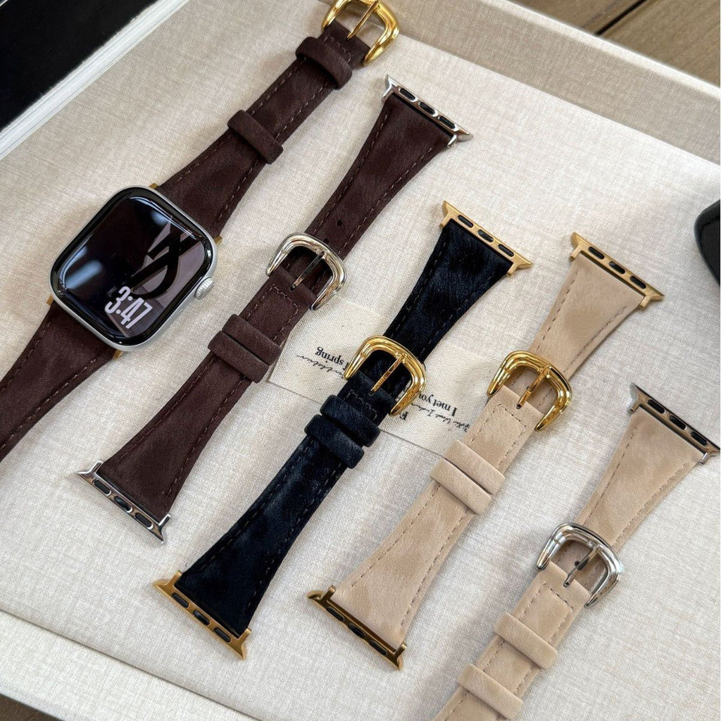 Bracelets en cuir pour Apple Watch en marron, noir et beige avec boucles dorées et argentées, finition élégante.