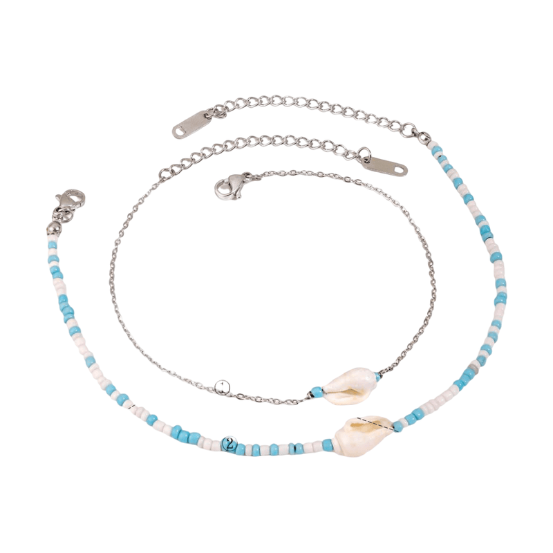 Bracelet de cheville double en acier inoxydable argenté, perles bleues et blanches, coquillages naturels.