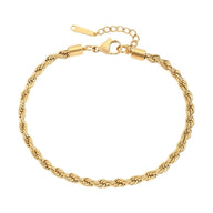 Bracelet de cheville en acier inoxydable doré, maille torsadée fine, fermoir mousqueton avec chaîne d’extension.