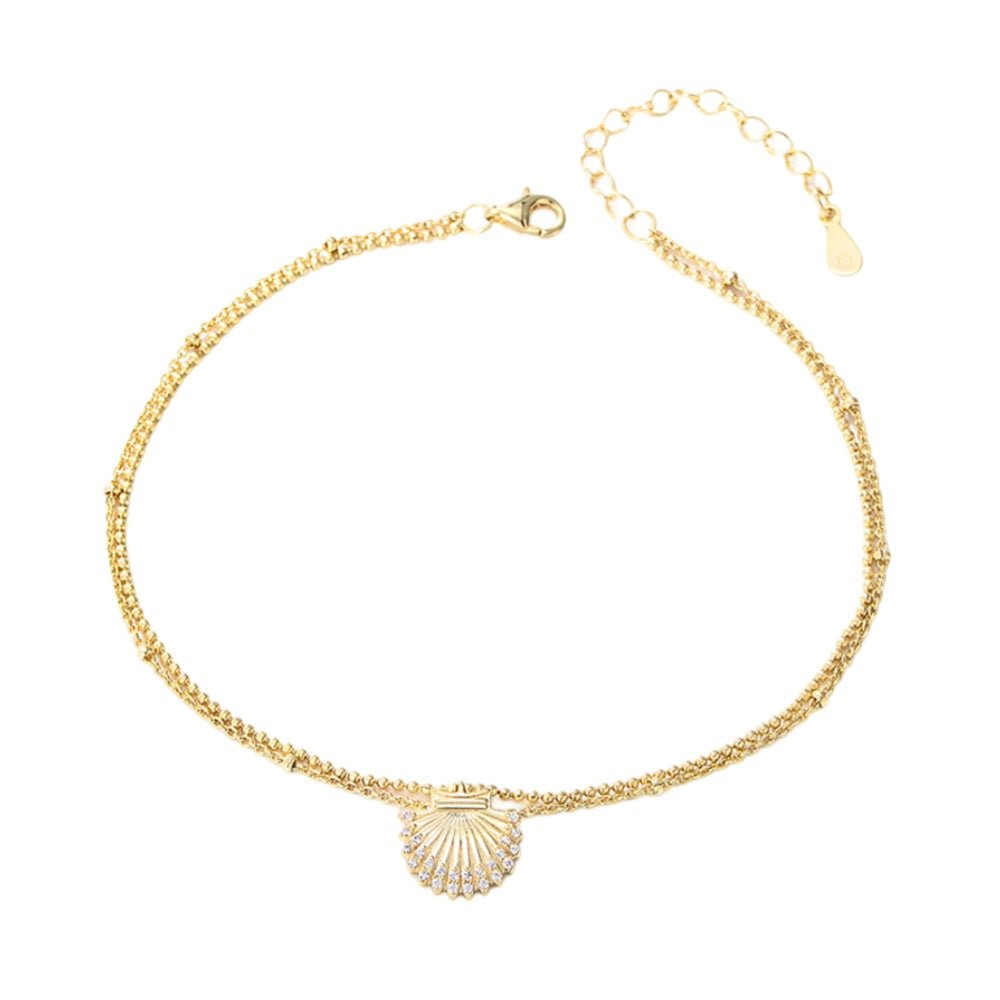Bracelet de cheville doré en argent sterling avec pendentif coquillage marine délicat.