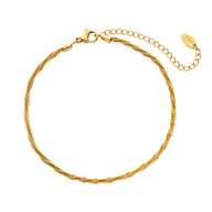 Bracelet de cheville en titane doré à maille scintillante et fermoir mousqueton avec chaîne ajustable.