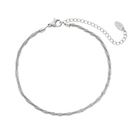 Bracelet de cheville en titane argenté à maille fine scintillante avec fermoir et chaîne ajustable.