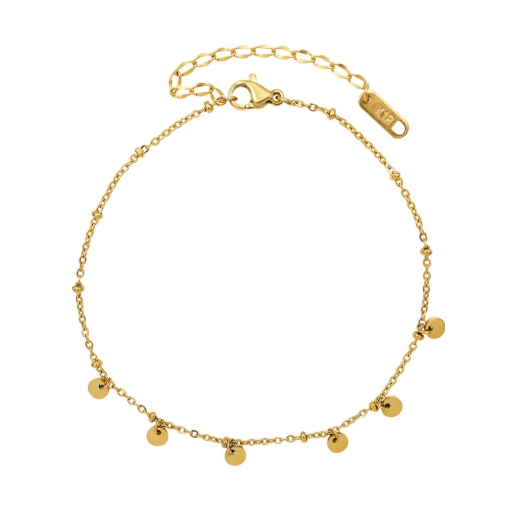 Bracelet de cheville en titane doré avec multiples petits médaillons ronds suspendus.