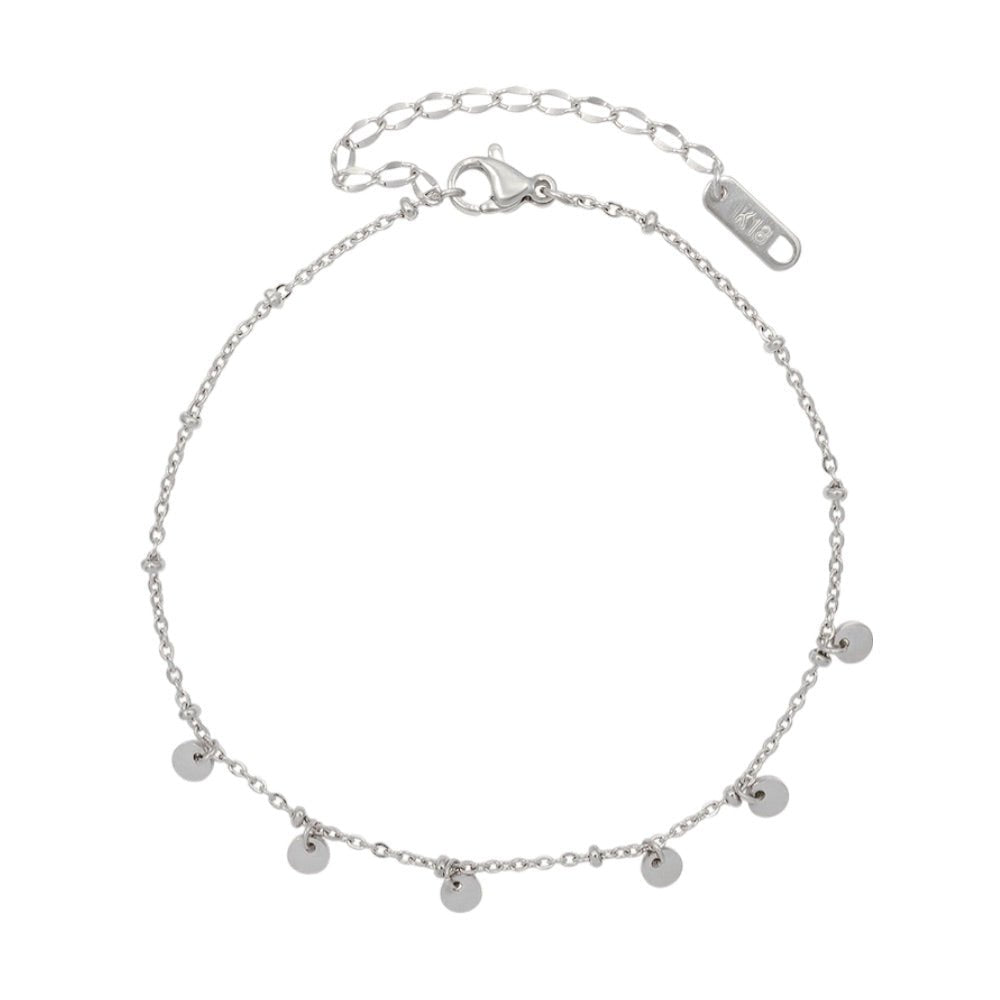 Bracelet de cheville en titane argenté avec cinq médaillons ronds suspendus et chaîne réglable.