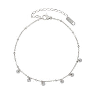 Bracelet de cheville en titane argenté avec cinq médaillons ronds suspendus et chaîne réglable.