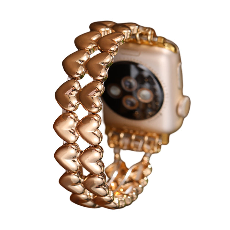 Bracelet doré pour Apple Watch à motifs de petits cœurs reliés, style féminin et élégant.