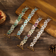 Bracelets Apple Watch femme à motif papillons, couleurs bleu, vert, multicolore et blanc, attaches dorées.