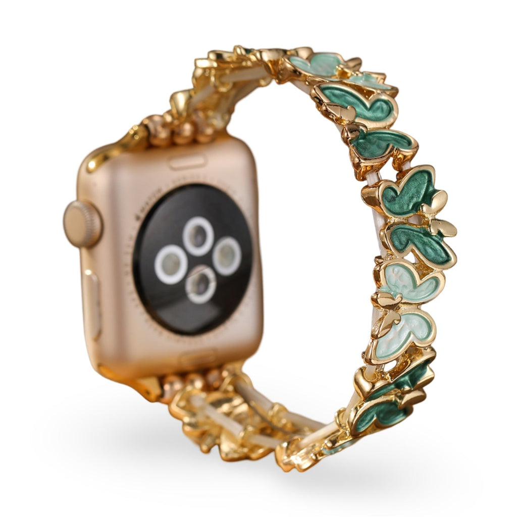 Bracelet Apple Watch doré à motif papillons verts et blancs pour femme, modèle Florencia.