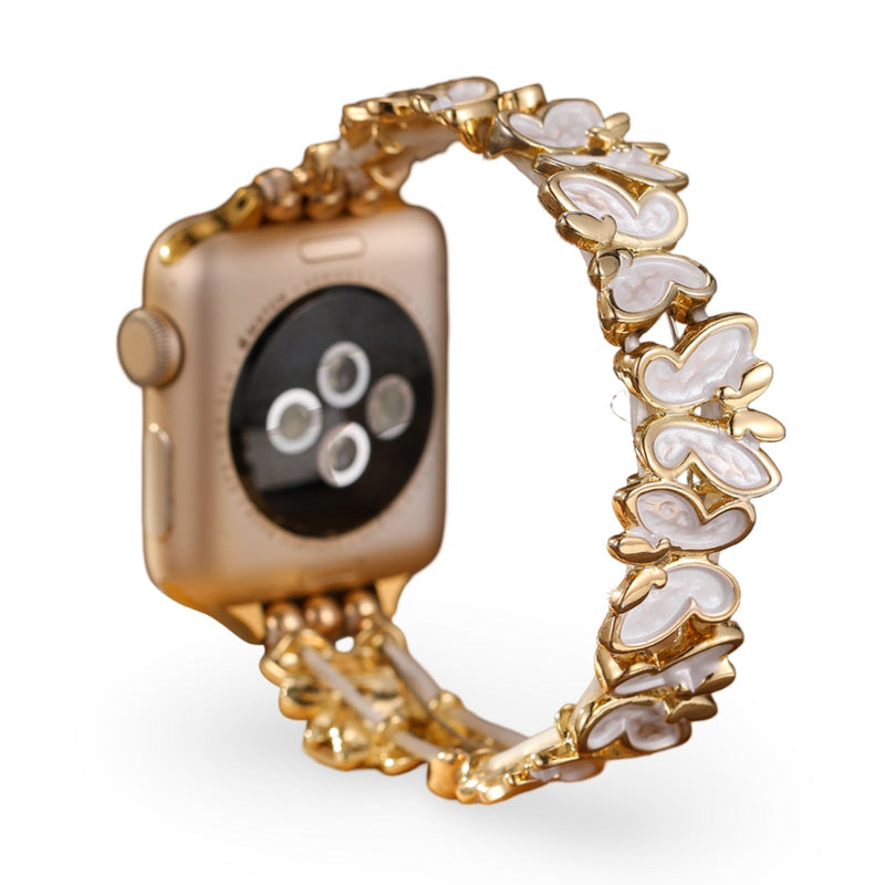 Bracelet Apple Watch doré avec motif papillons en nacre blanche pour femme, modèle Florencia.