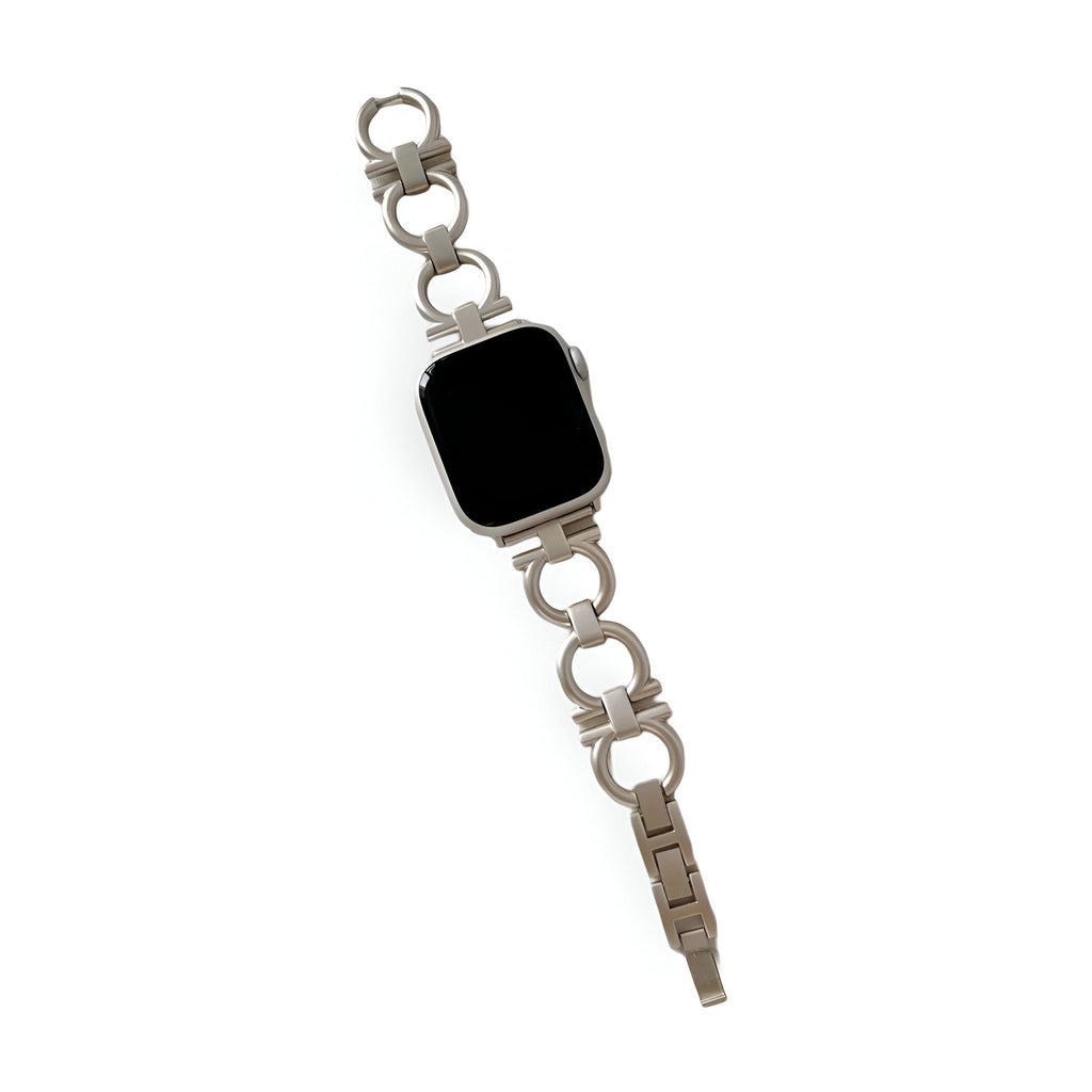 Bracelet Apple Watch circulaire en métal argenté avec maillons ronds pour femme.