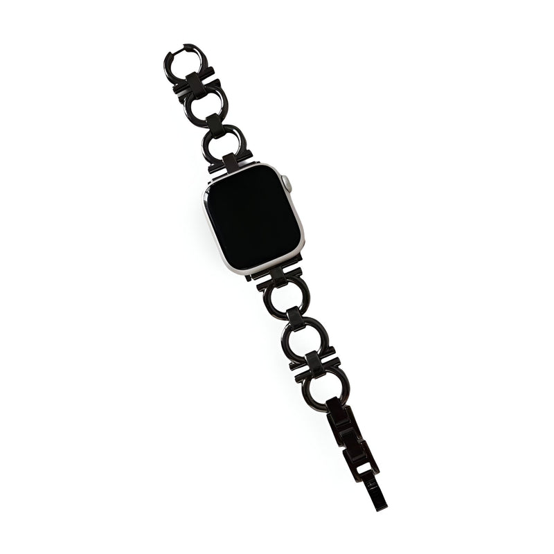 Bracelet pour Apple Watch en métal noir avec design circulaire et fermoir élégant.