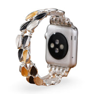 Bracelet pour Apple Watch femme aux pétales métalliques multicolores effet scintillant, style Raquel, taille ajustable.