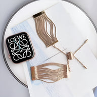 Bracelet Apple Watch or rosé en acier inoxydable avec lanières fines élégantes, pour femme, finition polie.